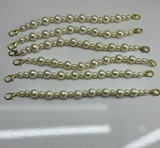 Enfeite de pérola para bolsas